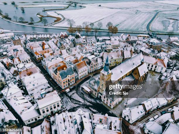 hattem aerial view during a cold winter morning - sneeuw nederland stockfoto's en -beelden