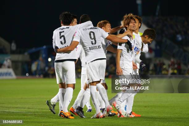 Sho Sasaki of Sanfrecce Hiroshima celebrates with teammates after scoring the team's second goal during the J.League Championship first leg match...