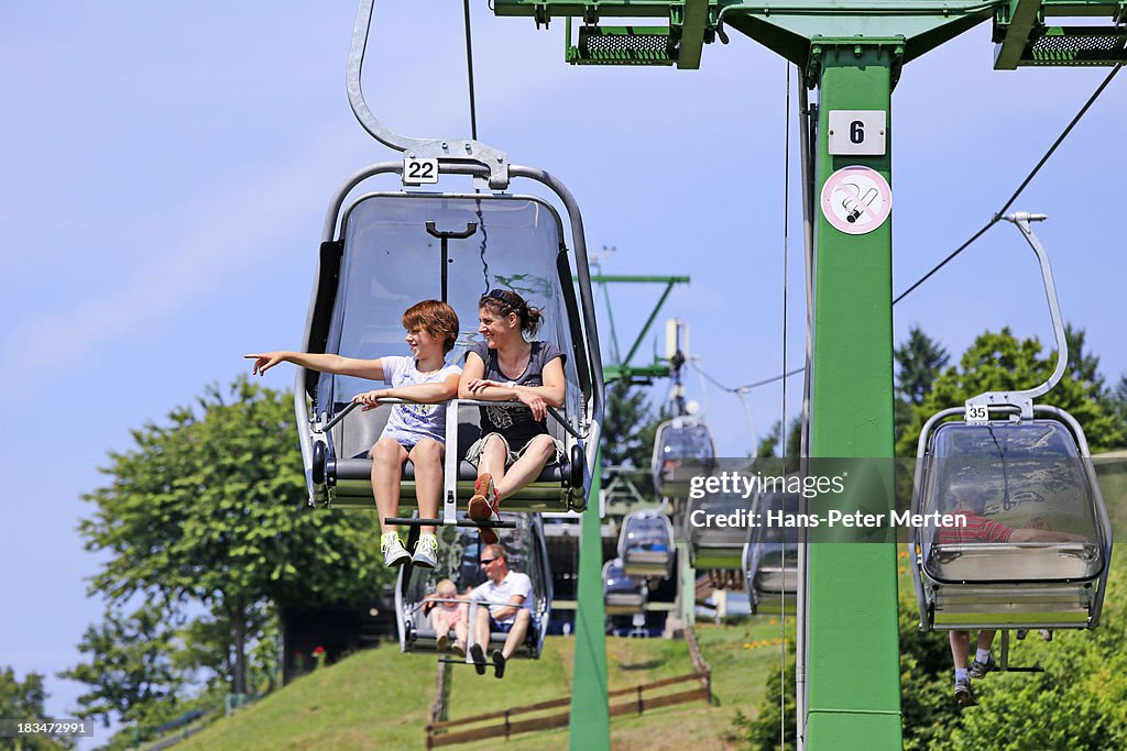 Young woman on chair lift