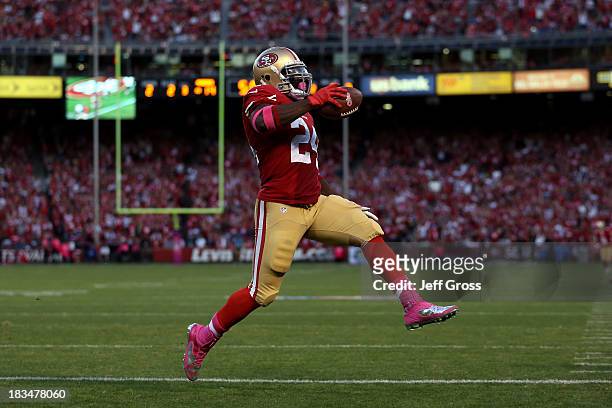 Anthony Dixon of the San Francisco 49ers scores a touchdown in the second quarter against the Houston Texans during their game at Candlestick Park on...