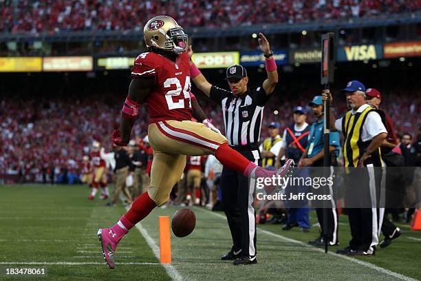 Anthony Dixon of the San Francisco 49ers scores a touchdown in the second quarter against the Houston Texans during their game at Candlestick Park on...