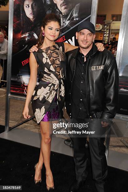 Actress Selena Gomez and director Courtney Solomon arrive at the 'Getaway' - Los Angeles Premiere at Regency Village Theatre on August 26, 2013 in...