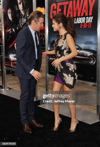 Actors Ethan Hawke and Selena Gomez arrive at the 'Getaway' - Los Angeles Premiere at Regency Village Theatre on August 26, 2013 in Westwood,...