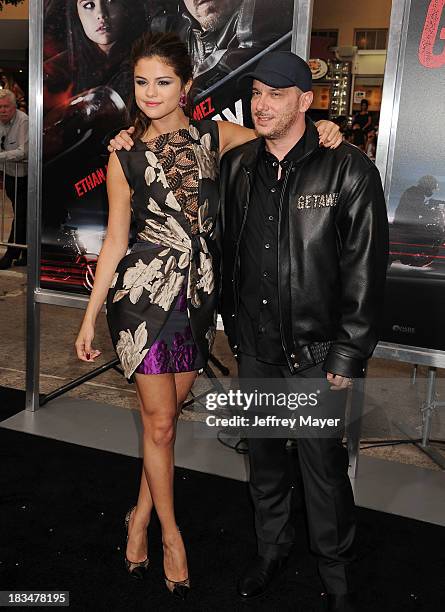 Actress Selena Gomez and director Courtney Solomon arrive at the 'Getaway' - Los Angeles Premiere at Regency Village Theatre on August 26, 2013 in...