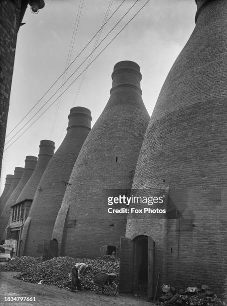 Man at work outside bottle kilns, Hanley, Stoke-on-Trent, UK, September 1935.