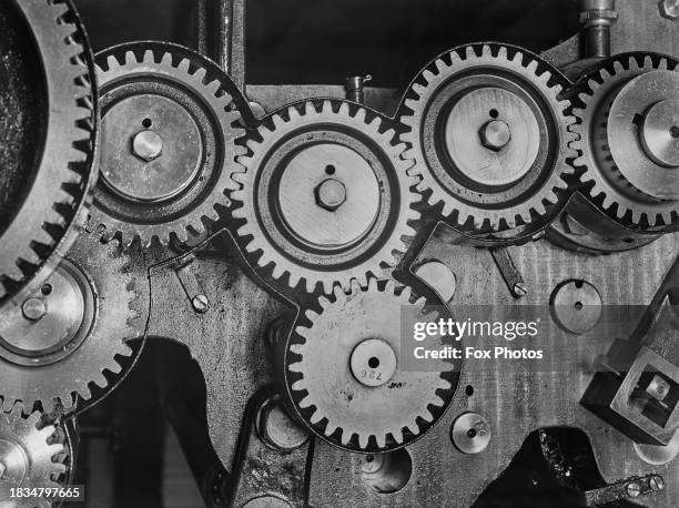 Close up of cogs, gears, and gear wheels of a machinery, UK, September 1935.