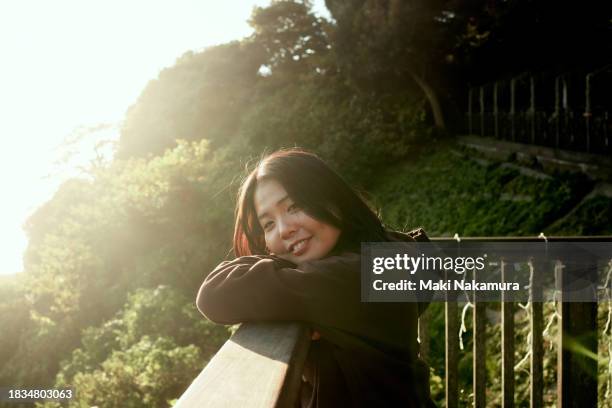 portraits of generation z. - female looking away from camera serious thinking outside natural stock-fotos und bilder