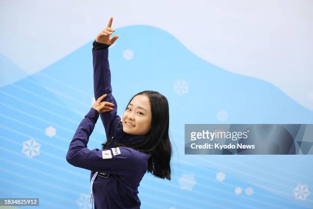 Japanese figure skater Mao Shimada poses in Beijing on Dec. 9 a day after becoming the Grand Prix Final junior winner back-to-back.