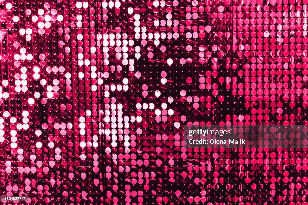 Pink glittering background. New Year and Christmas celebration concept.