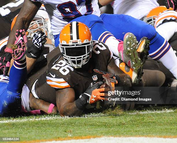 Running back Willis McGahee of the Cleveland Browns reaches the ball out over the goal line after scoring a touchdown during a game against the...