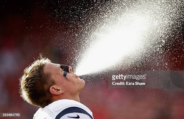 Watt of the Houston Texans spits water into the air before their game against the San Francisco 49ers at Candlestick Park on October 6, 2013 in San...