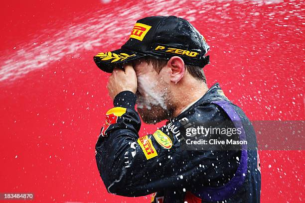 Sebastian Vettel of Germany and Infiniti Red Bull Racing celebrates on the podium after winning the Korean Formula One Grand Prix at Korea...