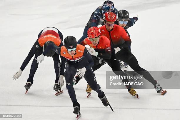 Skaters from the Netherlands, USA and China compete in the final A of the mixed team's 2000m relay at the ISU World Cup Short Track Speed Skating...