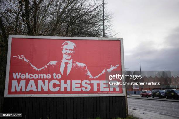 Billboard outside Manchester United's Old Trafford stadium declares 'Welcome To Manchester' and shows a depiction of Manchester United prospective...