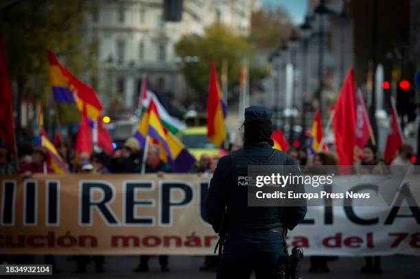 National Police officer in front of a protest against the Spanish Constitution, on December 6 in Madrid, Spain. The protest has been called by...