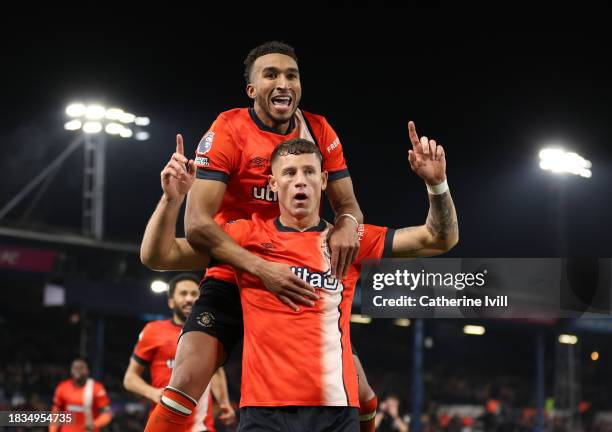 Ross Barkley of Luton Town celebrates after scoring the team's third goal with teammate Jacob Brown during the Premier League match between Luton...