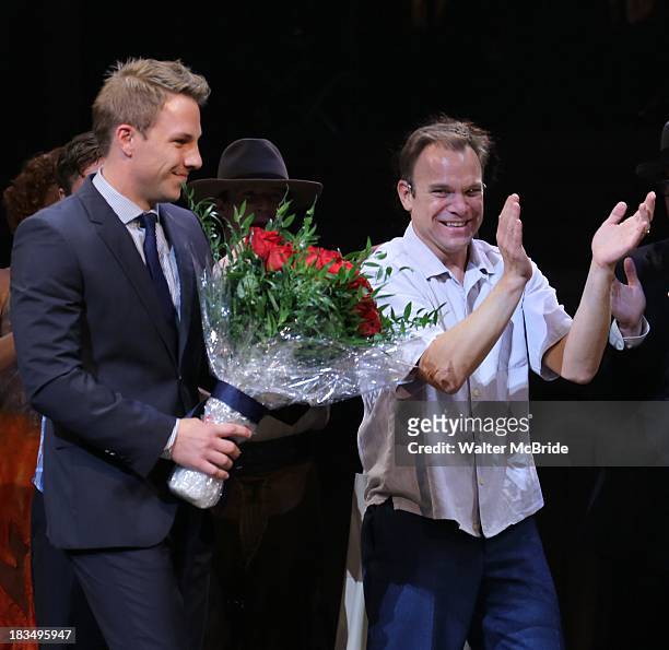 Joshua Buscher and Norbert Leo Butz take a bow during the Curtain Call for the "Big Fish" Broadway Opening Night at Neil Simon Theatre on October 6,...