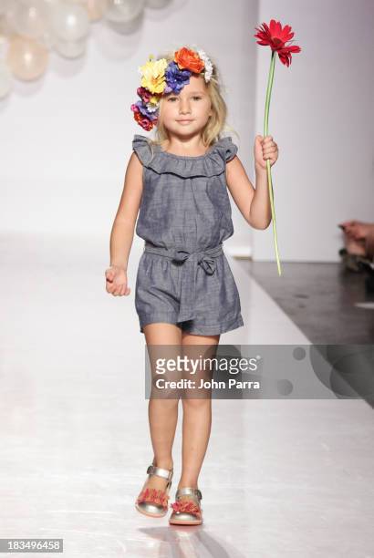Model walks the runway at the Stride Rite show during the petiteParade NY Kids Fashion Week in Collaboration with VOGUE Bambini on October 6, 2013 in...