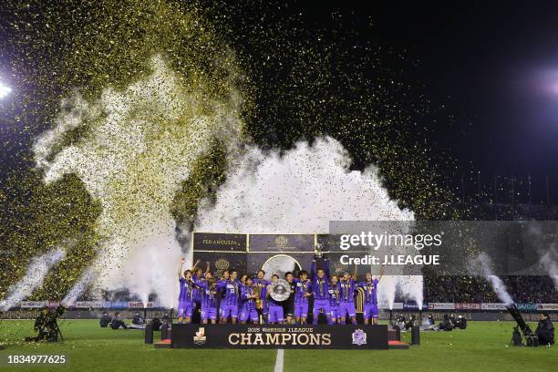Captain Toshihiro Aoyama of Sanfrecce Hiroshima lifts the J.League Champions plaque at the award ceremony following the J.League Championship second...