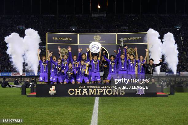 Captain Toshihiro Aoyama of Sanfrecce Hiroshima lifts the J.League Champions plaque at the award ceremony following the J.League Championship second...