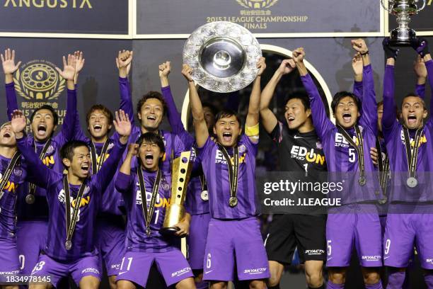 Captain Toshihiro Aoyama of Sanfrecce Hiroshima lifts the J.League Champions plaque at the award ceremony following the J.League Championship second...