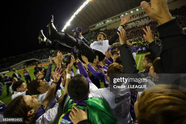 Head coach Hajime Moriyasu of Sanfrecce Hiroshima is tossed into the air following the J.League Championship second leg match between Sanfrecce...