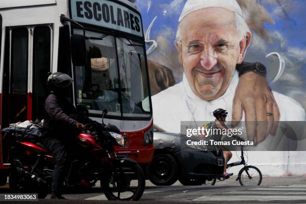 Mural depicting Pope Francis is seen as people wait on traffic lights on November 30, 2023 in Buenos Aires, Argentina. President-elect Javier Milei...