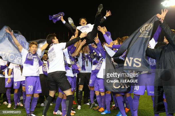 Head coach Hajime Moriyasu of Sanfrecce Hiroshima is tossed into the air following the J.League Championship second leg match between Sanfrecce...