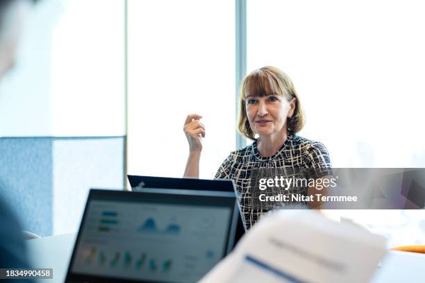 aligning risk management with business strategy to enhance confidence for your business. senior business executive in business performance meeting to determine direction with partner in a modern business office. business relationship, corporate business. - survivers stock pictures, royalty-free photos & images