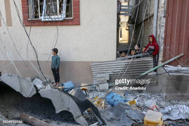 Residents living in the area, examine search for their furniture under the rubbles of the destroyed buildings after Israeli attacks in Rafah, Gaza on...