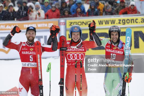 Marco Schwarz of Team Austria takes 2nd place, Marco Odermatt of Team Switzerland takes 1st place, Joan Verdu of Team Andorra takes 3rd place during...