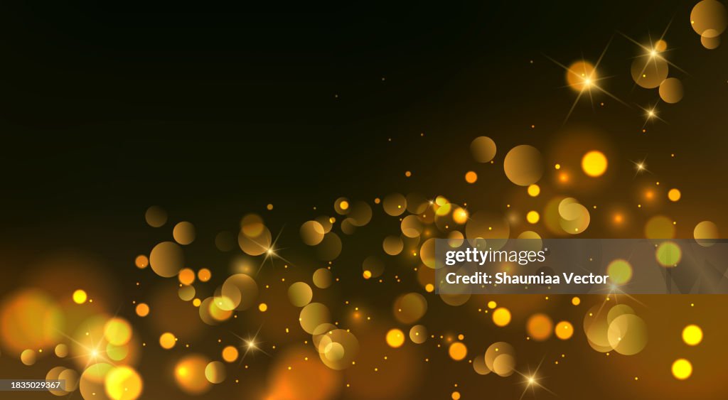 Abstract gold christmas bokeh lights and shiny sparkling background design