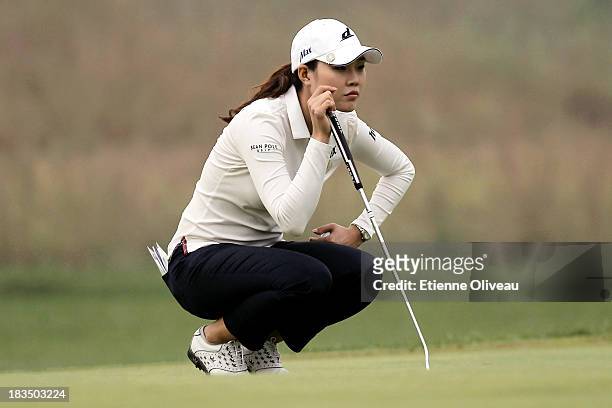 Hee Kyung Seo of South Korea llines up a putt during the final round of the Reignwood LPGA Classic at Pine Valley Golf Club on October 6, 2013 in...