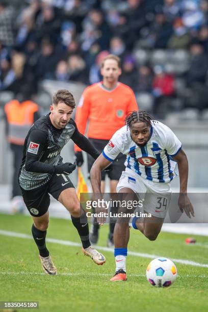 Manuel Feil of SV Elversberg battles for possession with Deyovaisio Zeefuik of Hertha BSC during the Second Bundesliga match between Hertha BSC and...