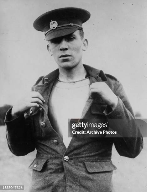 British Army line infantryman from the Essex Regiment of the British Expeditionary Force demonstrates a two-piece armoured waistcoat made of front...