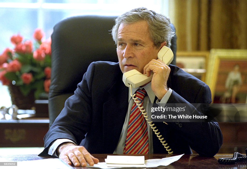 U.S. President George W. Bush Uses Telephone At White House