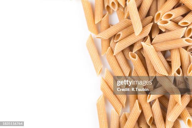 wholegrain penne pasta - vollkorn stock pictures, royalty-free photos & images