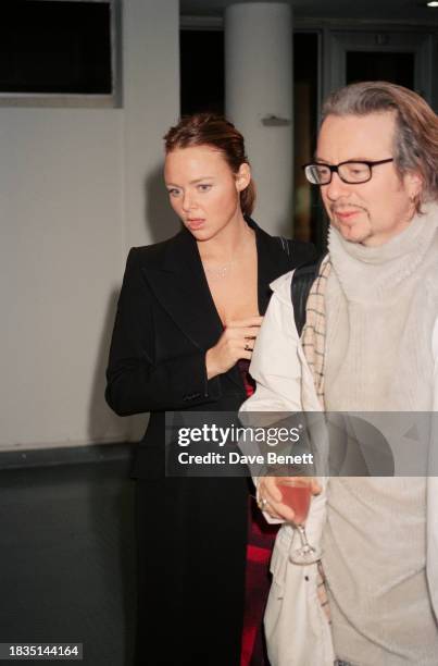 English fashion designer Stella McCartney and English musician Dave Stewart attend the War Child charity exhibition at the Royal College of Art,...