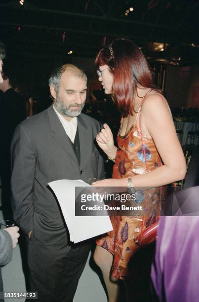 British television executive and presenter Alan Yentob with English broadcaster Janet Street-Porter at the War Child charity exhibition at the...