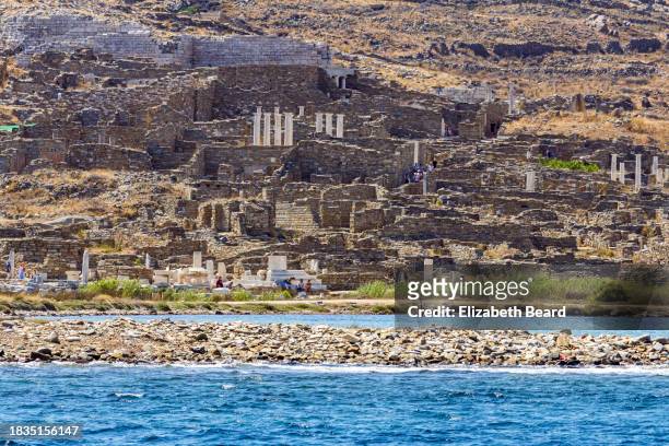 ruins on the island of delos, greece - delos stock-fotos und bilder