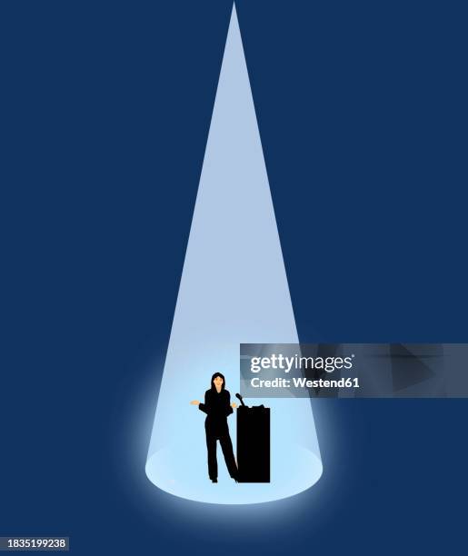 spotlight illuminating female public speaker - audio speakers stock illustrations