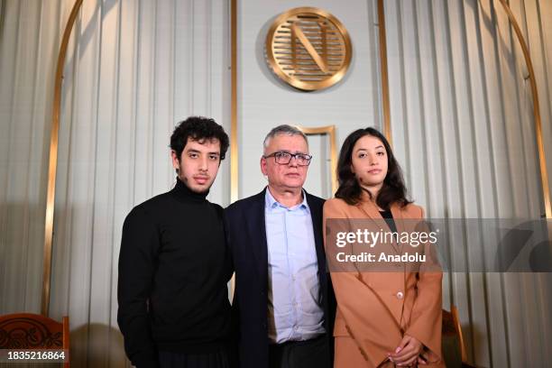 Taghi Rahmani , husband of Nobel Peace Prize 2023 laureate Narges Mohammadi, and their children Ali and Kiana pose for a photo after a press...