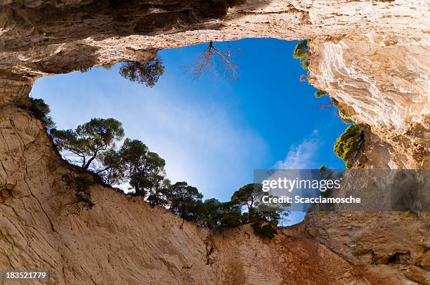 cave in apulia, italy - deep hole stock pictures, royalty-free photos & images