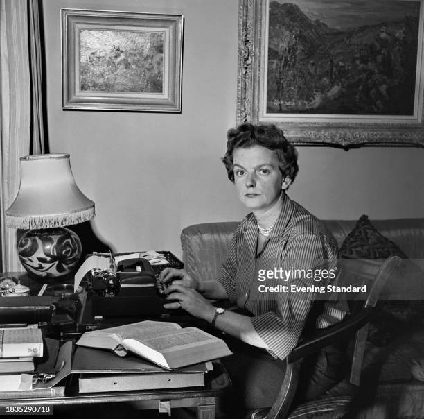 Author and art collector Lady Elizabeth Montagu typing at her desk, January 30th 1958.