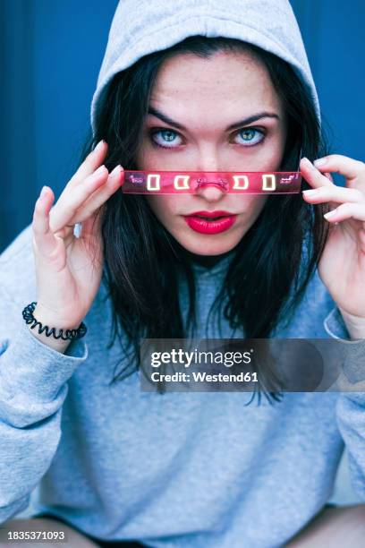 young woman with blue eyes adjusting smart glasses - pink lipstick stock pictures, royalty-free photos & images