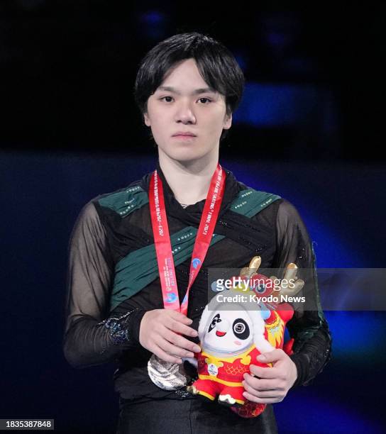 Shoma Uno of Japan poses after winning silver at the Grand Prix Final figure skating competition in Beijing on Dec. 9, 2023.