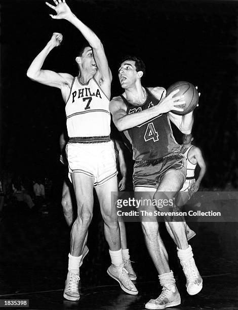 Dolph Schayes of the Syracuse Nationals drives to the basket against the Philadelphia Warriors during the 1950 season in Philadelphia, Pennsylvania....