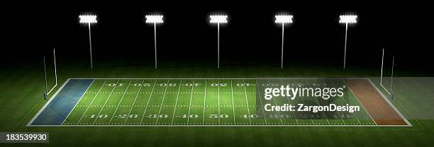 american football field at night - football pitch aerial stock pictures, royalty-free photos & images