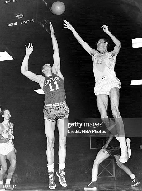 Jim Pollard of the Minneapolis Lakers shoots a jump shot against the Boston Celtics during the 1950 season in Minneapolis, Minnesota. NOTE TO USER:...