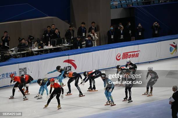 Skaters compete in teams during the men's 5000m relay semi-final event at the ISU World Cup Short Track Speed Skating in Beijing on December 9, 2023.